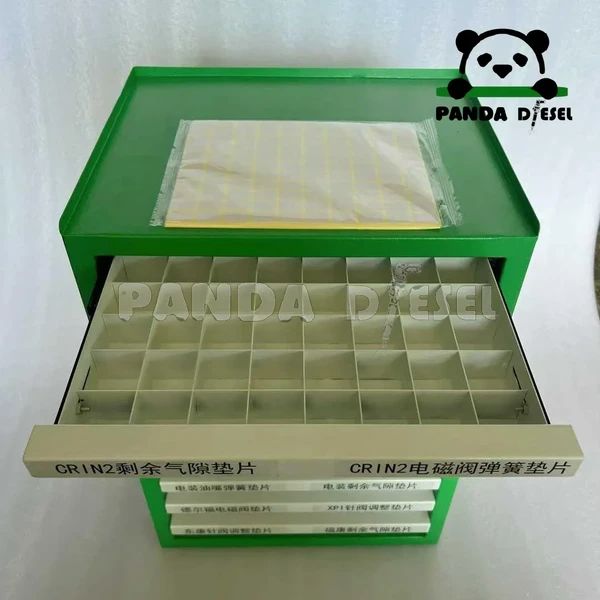 Boîte de rangement pour armoire d'établi destinée au fabricant de cales de rampe commune diesel et de pièces d'injecteur.